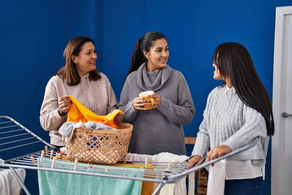 Three Woman Drinking Coffee Hanging Clothes Clothesline Laundry Room — Fotografia de Stock