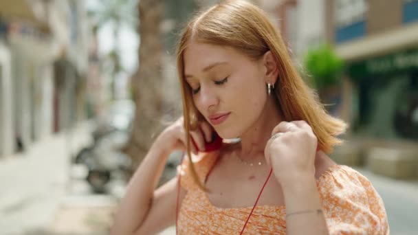Young Redhead Woman Smiling Confident Listening Music Street — Vídeos de Stock
