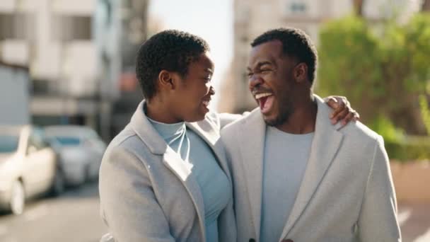 African American Couple Smiling Confident Hugging Each Other Walking Street — Video