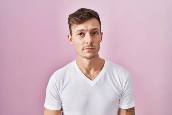 Caucasian Man Standing Pink Background Relaxed Serious Expression Face Simple — ストック写真