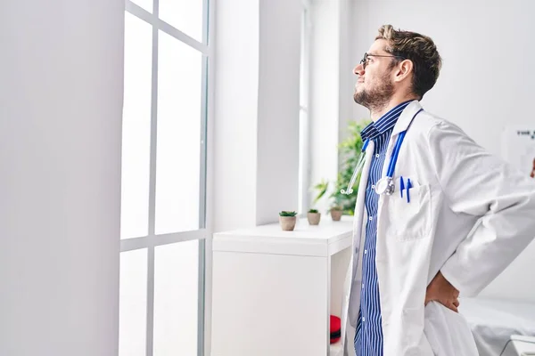 Young Man Doctor Looking Throw Window Standing Clinic — 图库照片