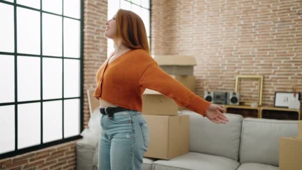 Young Redhead Woman Smiling Confident Standing Arms Open New Home — Video Stock