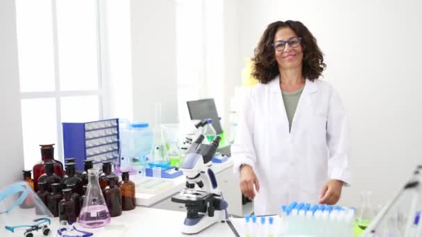 Middle Age Hispanic Woman Working Laboratory — Video Stock