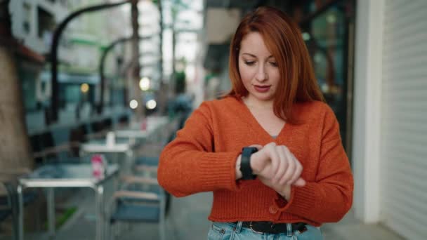 Young Redhead Woman Smiling Confident Looking Watch Street — Vídeo de Stock