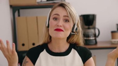 Young beautiful hispanic woman call center agent having video call at office