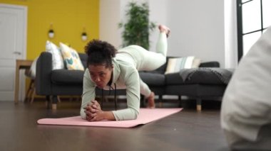 African american woman training legs exercise at home