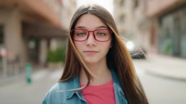 Adorable girl smiling confident wearing glasses at street