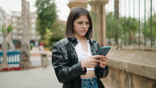 Young Hispanic Woman Winner Expression Using Smartphone Street — Stock Video