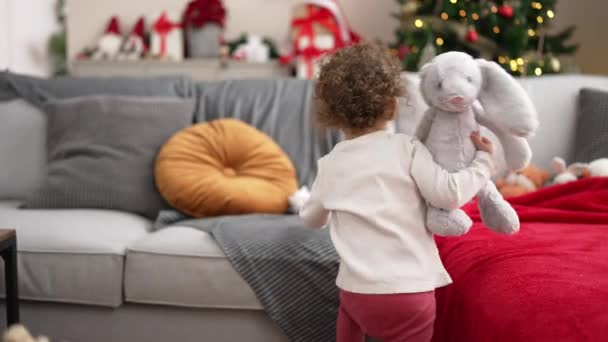 Adorable Caucasian Girl Playing Toys Sitting Sofa Christmas Tree Home — Vídeos de Stock