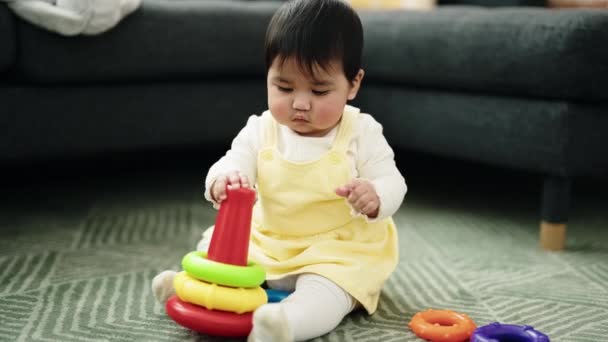 Adorable Hispanic Baby Playing Hoops Sitting Floor Home — Αρχείο Βίντεο