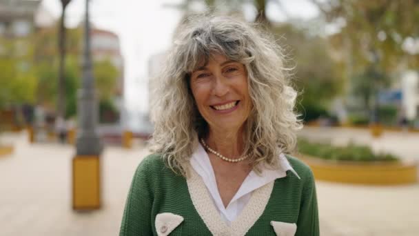 Middle Age Woman Smiling Confident Doing Sign Thumb Park — Vídeo de Stock