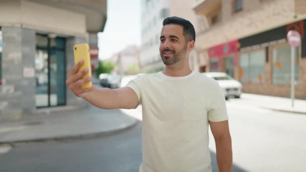 Young Hispanic Man Smiling Confident Making Selfie Smartphone Street — Stockvideo