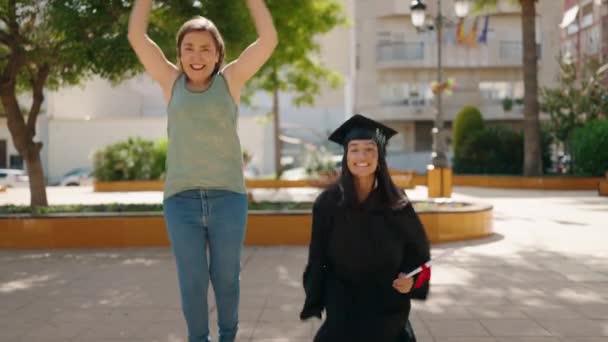 Two Women Mother Graduated Daughter Jumping Park — Videoclip de stoc