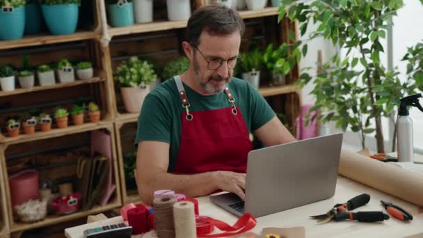 Middle Age Man Florist Smiling Confident Using Laptop Florist — Video