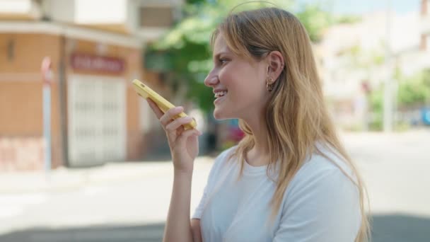 Young Blonde Girl Smiling Confident Talking Smartphone Street — Vídeos de Stock