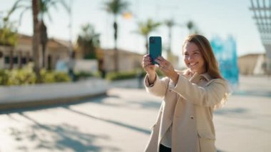 Middle age couple couple make picture using smartphone at park