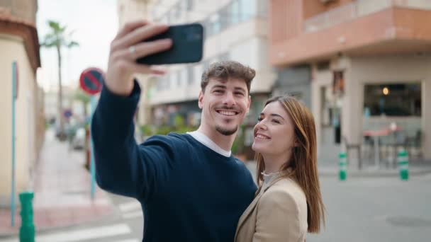 Young Couple Smiling Confident Making Selfie Smartphone Street — стоковое видео