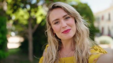 Young woman smiling confident having video call at park