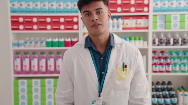 Young Hispanic Man Pharmacist Speaking Pharmacy — Stockvideo