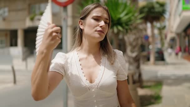 Young Caucasian Woman Using Handfan Sweating Street — Vídeos de Stock