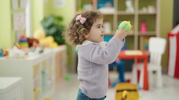 Adorable Hispanic Girl Playing Balls Standing Kindergarten — Wideo stockowe