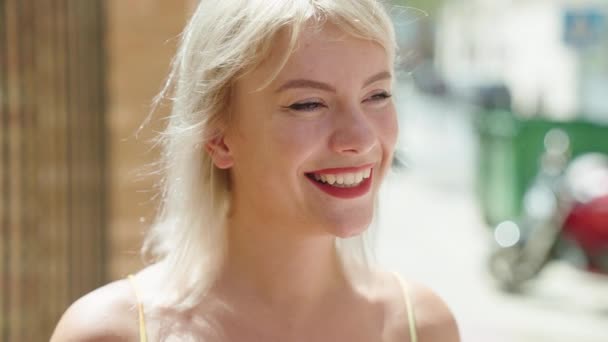 Young Blonde Woman Smiling Confident Looking Side Street — Wideo stockowe