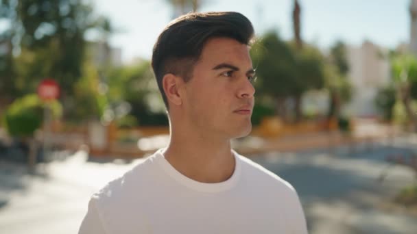 Young Hispanic Man Serious Expression Standing Street — Stock video