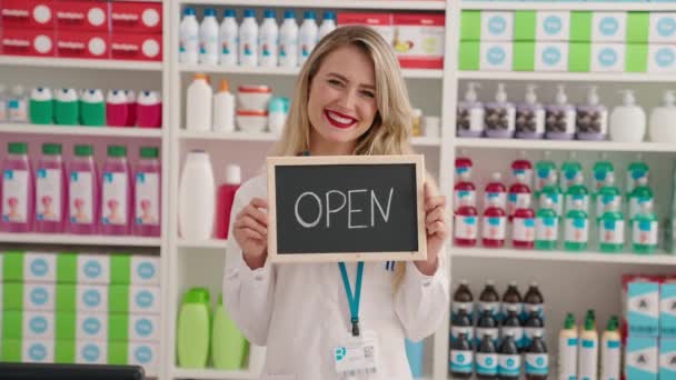 Young Beautiful Hispanic Woman Pharmacist Smiling Confident Holding Open Blackboard — Video
