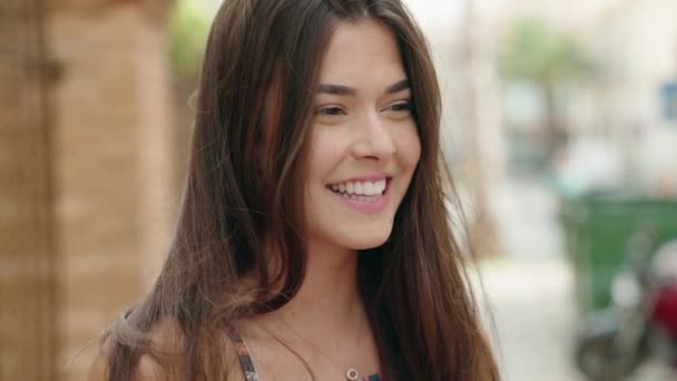 Young Beautiful Hispanic Woman Smiling Confident Looking Side Street — Video