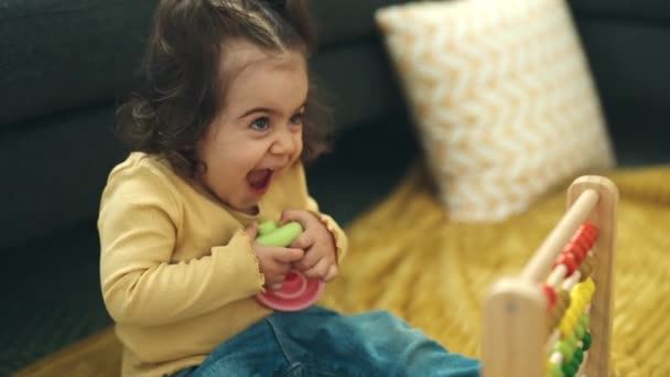 Adorable Hispanic Girl Smiling Tickles Sitting Sofa Home — Wideo stockowe