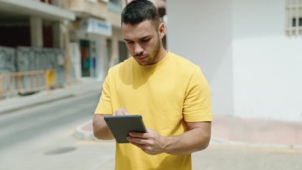 Young Hispanic Man Smiling Confident Using Touchpad Street — Wideo stockowe