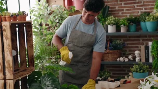 Young Hispanic Man Florist Using Difusser Working Flower Shop — Vídeo de Stock