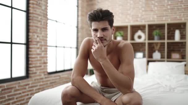 Young Hispanic Man Smiling Confident Sitting Bed Bedroom — Αρχείο Βίντεο