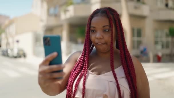 African American Woman Smiling Confident Having Video Call Street — Stockvideo
