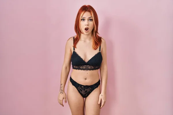 Young Caucasian Woman Wearing Lingerie Pink Background Shock Face Looking — Zdjęcie stockowe