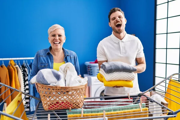 Hispanic Mother Son Hanging Clothes Clothesline Smiling Laughing Hard Out — Stock Photo, Image