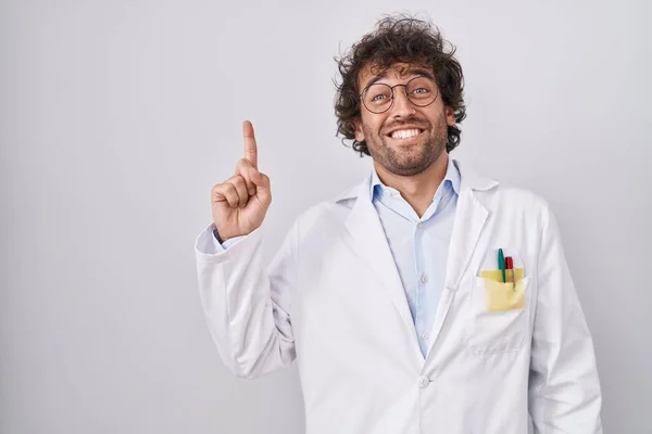 Hispanic Young Man Wearing Doctor Uniform Pointing Finger Successful Idea — Stock Photo, Image