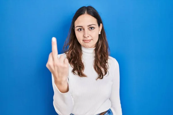 Young Hispanic Woman Standing Blue Background Showing Middle Finger Impolite — Stockfoto