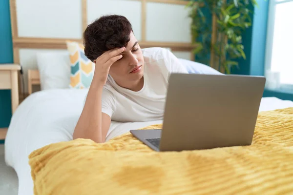 Non Binary Man Using Laptop Worried Expression Bedroom — Stockfoto