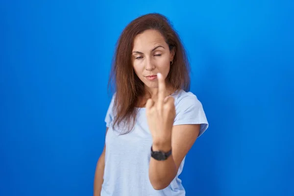 Brunette Woman Standing Blue Background Showing Middle Finger Impolite Rude — Foto de Stock