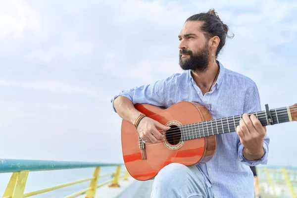 Young Hispanic Man Musician Playing Classical Guitar Seaside Stock Picture