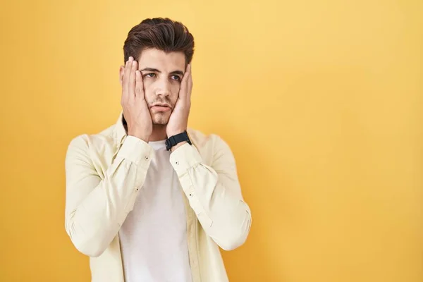 Young Hispanic Man Standing Yellow Background Tired Hands Covering Face — Stock fotografie