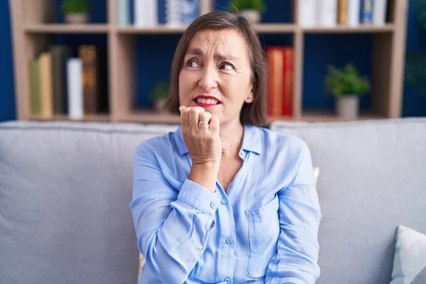 Middle Age Hispanic Woman Sitting Sofa Home Looking Stressed Nervous — Stock Photo, Image