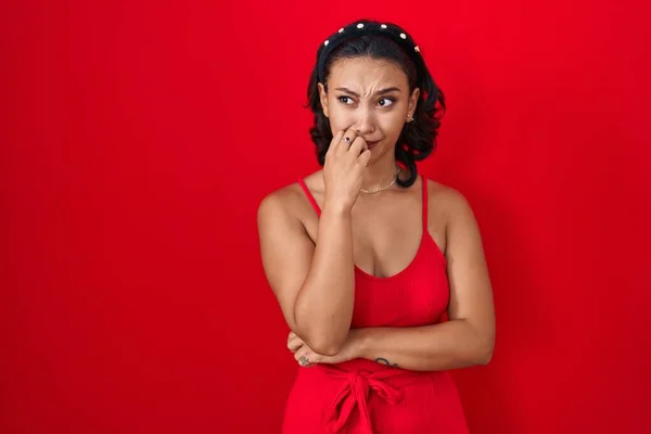 Young Hispanic Woman Standing Red Background Looking Stressed Nervous Hands — Stockfoto