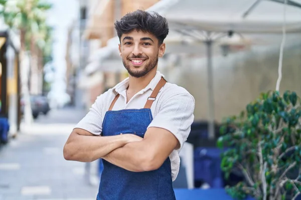 Young Arab Man Waiter Standing Arms Crossed Gesture Restaurant — Fotografia de Stock