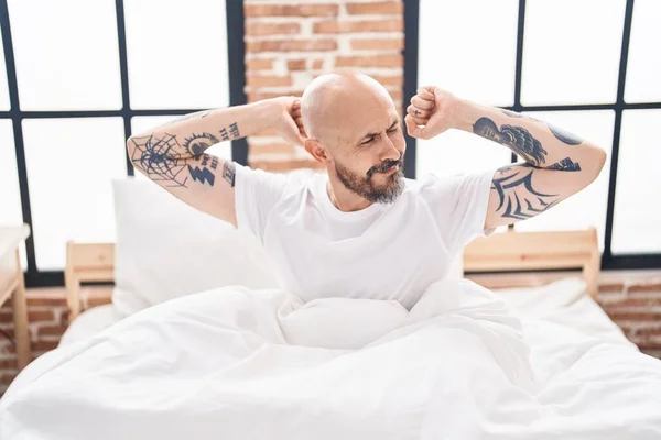Young Bald Man Waking Stretching Arms Bedroom — Stock Photo, Image