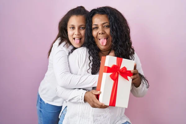 Mother Young Daughter Holding Presents Sticking Tongue Out Happy Funny — Stock Photo, Image