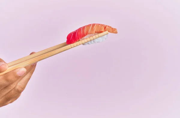 Hand Man Holding Tuna Nigiri Chopsticks Isolated Pink Background — Stockfoto