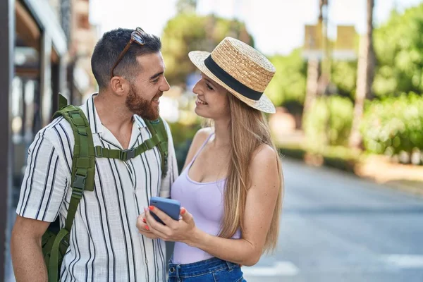 Man Woman Tourist Couple Smiling Confident Using Smartphone Street — 스톡 사진
