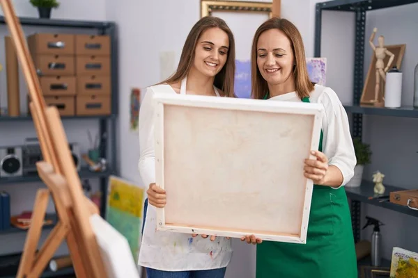 Two Women Artists Smiling Confident Holding Draw Canvas Art Studio — ストック写真